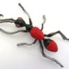 M Godart insect brooch red black
