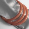 3 orange bakelite spacer bangles