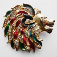 lion brooch red green black