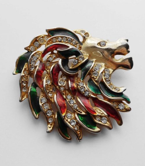 lion brooch red green black