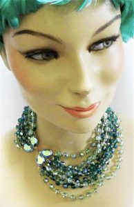 multistrand green beads necklace on dummy