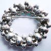 green diamante brooch back