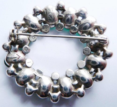 green diamante brooch back