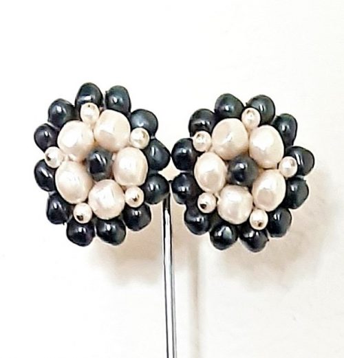 Monet pearls clip earrings on stand