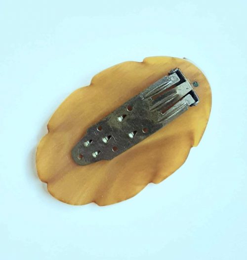 yellow bakelite dress clip back